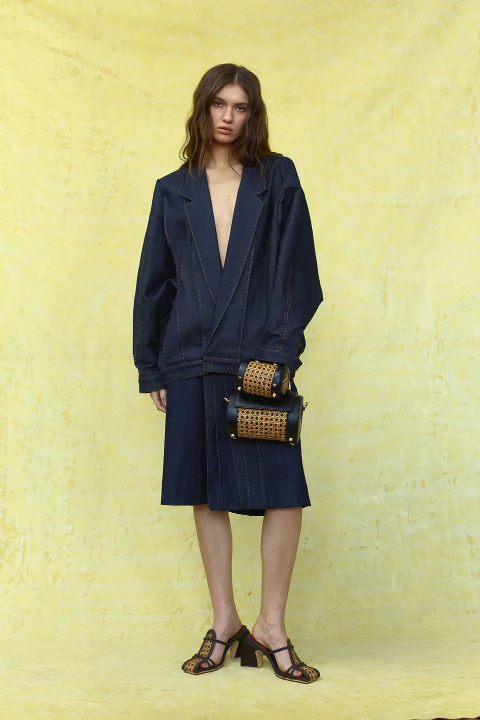 Spring Summer 2027: Full-length shorts tailoring with black roller bags