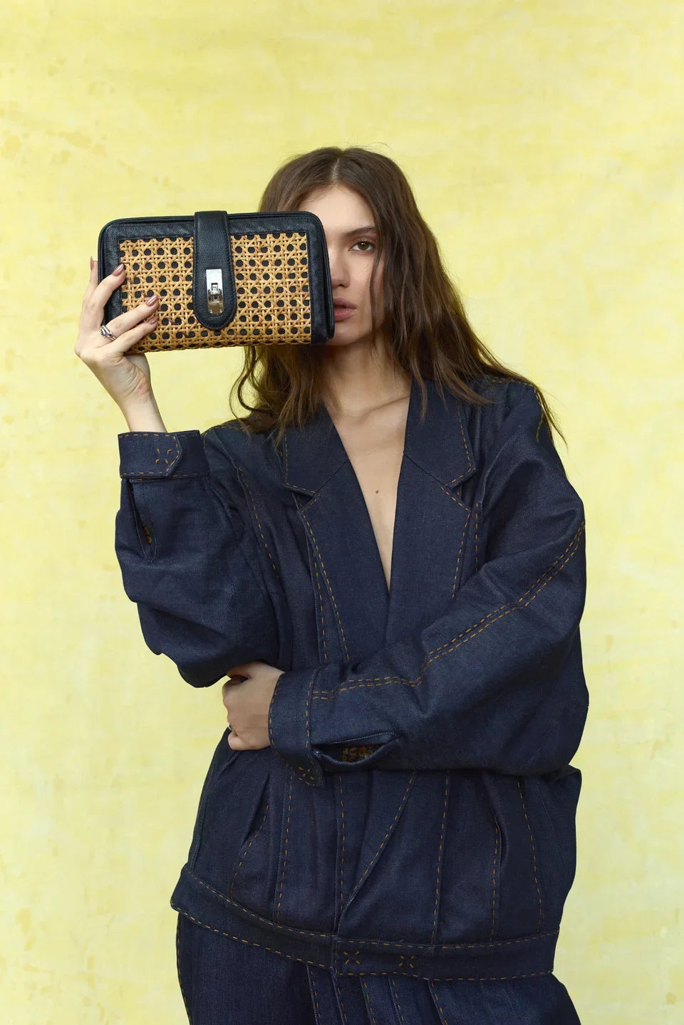 Spring Summer 2027: Close editorial view of the black woven roller